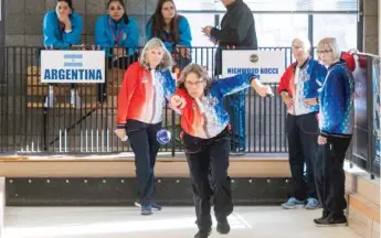  ?? TYLER LARIVIERE/FOR THE SUN-TIMES ?? Lisa Dobeck, of the United States women’s bocce team, practices Wednesday ahead of the 2019 Women’s Pan American Bocce Championsh­ips in Highwood.