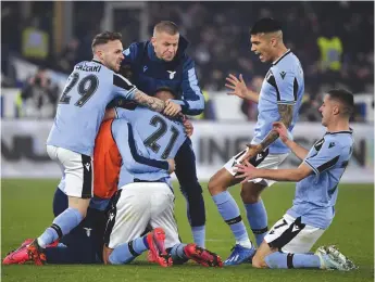  ?? AP ?? Sergej Milinkovic-Savic (centre) of Lazio celebrates after scoring his side’s second goal during the Italian league football match against Inter Milan at Rome’s Olympic stadium on Sunday. Lazio won 2-1. —