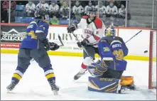  ?? ERIC CEDERBERG ?? Ryan Foss watches the puck go in on the Acadia Axemen’s second goal against Moncton.