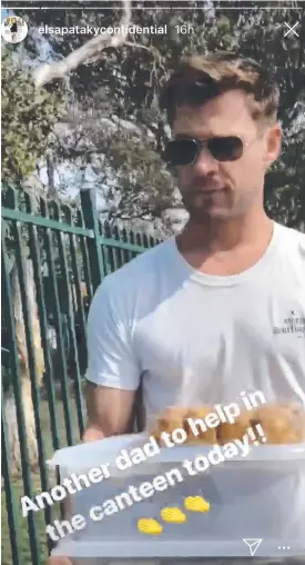  ??  ?? Chris Hemsworth helping out in Byron Bay Public School's canteen after Tuesday’s lockdown in response to a teacher being attacked on school grounds.