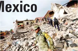  ??  ?? PICKING UP THE PIECES – Soldiers work to remove the debris of a house destroyed in Juchitan, Mexico after a powerful magnitude-8.1 quake struck off the southern coast of Mexico, September 7. (Reuters)