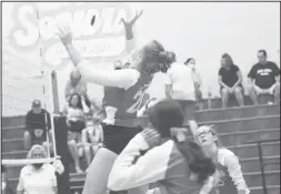  ??  ?? MaKynlee Overton reaches for the ball during the Coahoma-Grape Creek Varsity volleyball game.