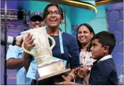  ?? ALEX BRANDON — THE ASSOCIATED PRESS ?? Harini Logan, 14, from San Antonio, Texas, celebrates winning the Scripps National Spelling Bee with her family, brother Naren Logan, right, mom Rampriya Logan, second from right, and dad Logan Anjaneyulu, left, June 2 in Oxon Hill, Md.