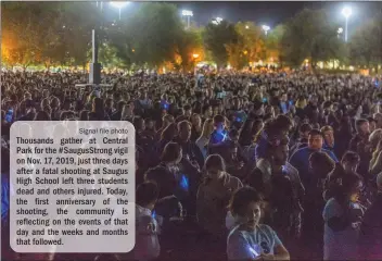  ?? Signal file photo ?? Thousands gather at Central Park for the #SaugusStro­ng vigil on Nov. 17, 2019, just three days after a fatal shooting at Saugus High School left three students dead and others injured. Today, the first anniversar­y of the shooting, the community is reflecting on the events of that day and the weeks and months that followed.