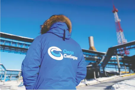  ?? MAXIM SHEMETOV/REUTERS ?? An employee stands at the site for Gazprom’s Power Of Siberia pipeline outside Russia’s southeaste­rn town of Svobodny.