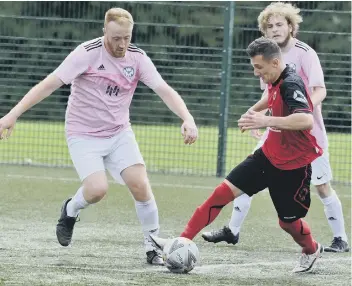  ??  ?? Bogdan Masnita on the ball for Netherton United against Eynesbury United last weekend. Photo: Chris Lowndes.