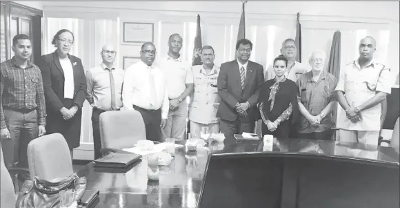  ??  ?? Public Security Minister Khemraj Ramjattan (fifth from right), acting Police Commission­er David Ramnarine (sixth from right) and acting Prisons Director Gladwin Samuels (at extreme right) with members of the Private Sector Commission