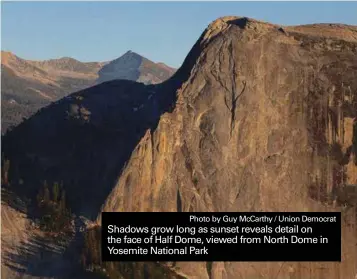  ?? Photo by Guy McCarthy / Union Democrat ?? Shadows grow long as sunset reveals detail on the face of Half Dome, viewed from North Dome in Yosemite National Park