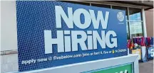  ?? David Zalubowski/Associated Press ?? A hiring sign beckons potential employees to apply for work April 11 inside a discount store in Centennial, Colo.