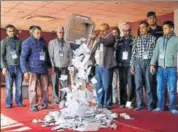  ?? REUTERS ?? An official from the Election Commission pours ballot papers from the box in Kathmandu on Friday.