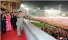  ?? Photograph: KCNA/Reuters ?? Kim Jong-un waves to the crowds at the parade.