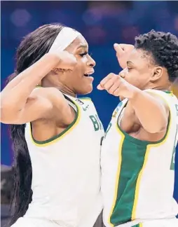  ?? CARMEN MANDATO/GETTY ?? Baylor’s Queen Egbo, left, and Moon Ursin, right, celebrate their 78-75 win over Michigan in the Sweet 16 of the NCAA Tournament on Saturday at the Alamodome in San Antonio, Texas.