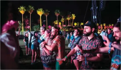  ??  ?? Fans watch as Jean-Michel Jarre performs during the Coachella Music and Arts Festival.