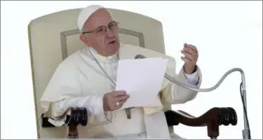  ?? ALESSANDRA TARANTINO — THE ASSOCIATED PRESS FILE ?? Pope Francis delivers his speech during his weekly general audience in St. Peter’s Square at the Vatican.