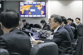  ?? AP/Yonhap ?? South Korean President Moon Jae-in presides over a security council meeting today in Seoul after reports that North Korea had launched an interconti­nental ballistic missile into Japanese waters.