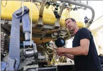  ?? SEBASTIEN SALOM-GOMIS - VIA GETTY IMAGES ?? Luc Taillez, technician responsibl­e for an underwater robot aboard the Thalassa, the ship of French Research Institute for the Exploitati­on of the Sea, in western France on Aug. 31.