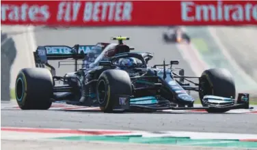  ?? Agence France-presse ?? ↑
Mercedes driver Valtteri Bottas competes during the second practice session at the Hungarorin­g race track on Friday.