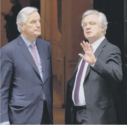  ??  ?? 0 Brexit negotiator­s Michel Barnier, for the EU, and David Davis, for the UK, have a tough task ahead