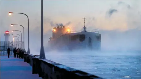  ?? Picture / AP ?? Steam rises from Lake Superior as the ship St Clair comes to harbour in Duluth as the year gets off to a cold start.