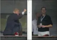  ?? JULIE JACOBSON — THE ASSOCIATED PRESS ?? President Donald Trump pumps his fist as he reacts to spectators from a viewing platform with his son Eric Trump, right, near the 15th green during the second round of the U.S. Women’s Open Golf tournament Friday in Bedminster, N.J.