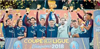  ?? AFP ?? Thiago Silva of Paris Saint-Germain (centre) lifts the trophy as he celebrates with teammates after victory in the French League Cup final against Monaco at The Matmut Atlantique Stadium in Bordeaux. PSG won 3-0. —