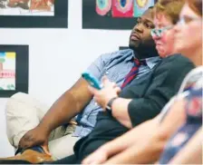  ?? STAFF PHOTO BY C.B. SCHMELTER / ?? Dennis Clark, who ran for the Tennessee House District 28 seat, listens as superinten­dent candidate Timothy Gadson III answers his question during a public meet-and-greet Wednesday.