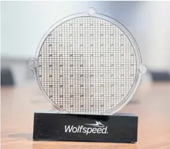  ?? REUTERS ?? Wolfspeed’s silicon carbide 200mm wafer is seen on display at its facility in Marcy, New York.