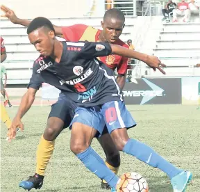  ?? FILE ?? St Andrew Technical’s Steven McQueen (right) and Jamaica College’s Tyreek Magee.