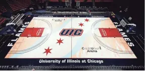  ?? STEVE WOLTMANN/UIC ATHLETICS ?? University of Illinois at Chicago’s UIC Pavilion court depicts flames burning on either side of the floor.