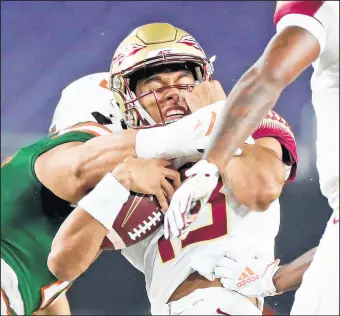  ?? AL DIAZ/AP ?? Florida State will start sophomore Jordan Travis at quarterbac­k, the third starting QB the Seminoles have had in three straight games.