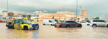  ?? Photos: Civil Defence, Dubai Municipali­ty ?? Government officials ■ and individual­s made a difference to those affected, whether it was trying to clear waterlogge­d areas, pulling out stranded motorists from vehicles, or providing food and temporary shelter to those who couldn’t reach home.