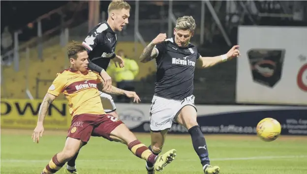  ?? PICTURE: PAUL DEVLIN/ SNS ?? 0 Craig Tanner pounces to score the only goal at Dens Park as in- form Motherwell extended their winning sequence to four games.