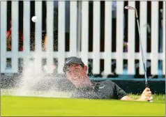  ?? (CHARLIE RIEDEL/AP PHOTO) ?? Rory McIlroy hits out of a bunker near the seventh green during the second round of the PGA Championsh­ip at Bellerive Country Club on Friday in St. Louis. Gary Woodland leads by a stroke, but play was suspended Friday due to a storm.