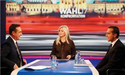  ?? Photograph: Leonhard Foeger/Reuters ?? Heinz-Christian Strache, left, head of the Freedom party, presenter Claudia Reiterer and incumbent chancellor Christian Kern, right, on the TV debate in Vienna.