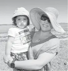  ??  ?? Twenty-one-month-old Dahlia Millar and mom Alexandra Millar take in the beach’s natural beauty.