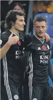  ??  ?? Jamie Vardy, right, scored his 19th goal in 21 league games