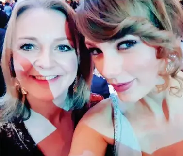  ??  ?? Taylor-made selfie: A grinning Liz Truss with Miss Swift at the Baftas ceremony