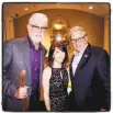  ??  ?? S.F. Giants announcers Mike Krukow (left) and Duane Kuiper flank Giants Community Fund director Sue Petersen at the Guardsmen auction.