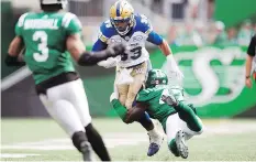  ?? TROY FLEECE ?? Samuel Eguavoen, shown tackling the Blue Bombers’ Andrew Harris, leads the Roughrider­s with 61 defensive tackles and has scored two touchdowns: one off an intercepti­on and the other after a punt block.