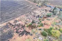  ?? ?? Newly added graves for attack victims mark a Hroza cemetery. The attack came as residents gathered for a wake.