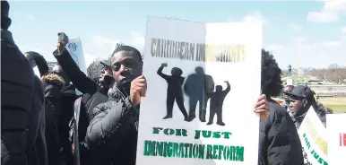  ??  ?? In this March 2013 AP file photo, Caribbean youth press their case for inclusive immigratio­n reform at a Washington DC rally in the United States.