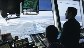  ?? SETH WENIG / THE ASSOCIATED PRESS ?? Air traffic controller­s work at John F. Kennedy Internatio­nal Airport in New York.