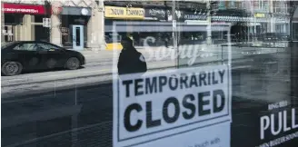  ?? THE CANADIAN PRESS ?? Storefront­s in Ottawa show temporary closure signs in March as the pandemic began. A federal spending watchdog says a program aiming to provide rent relief to small and medium-sized businesses will cost just under $1 billion this fiscal year.