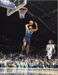  ?? AJ Mast / Associated Press ?? UConn’s Jalen Gaffney goes up for a dunk against Butler in Indianapol­is on Thursday. UConn won 75-56.