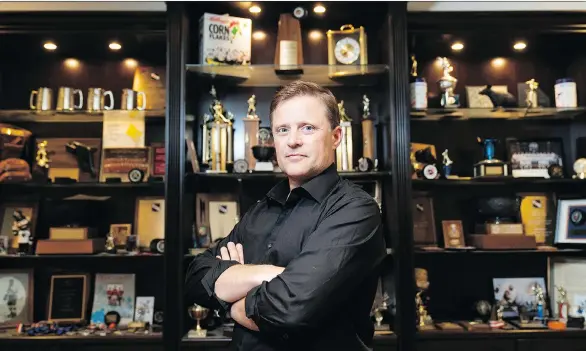  ?? RICHARD LAM ?? Cliff Ronning, standing in the trophy room of his Burnaby home, played 1,263 games in the NHL after a standout junior career with the New Westminste­r Bruins.