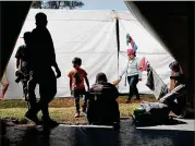  ?? SPENCER PLATT / GETTY IMAGES ?? Members of the Central American migrant caravan arrived in Mexico City on Tuesday. The migrants will decide when and how to continue their journey towards the United States border.