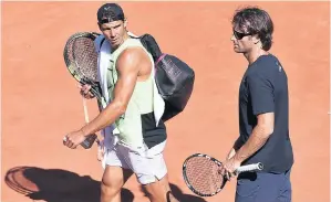  ??  ?? Guiding hand: Carlos Moya (right) has helped Rafael Nadal refine his game and pump up his body as he chases a 10th French Open title