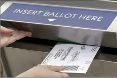  ?? AP file photo ?? A Michigan voter inserts her absentee voter ballot into a drop box in Troy, Mich. on Oct. 15, 2020. What happens if a ballot is damaged or improperly marked? Election workers reconstruc­t or “duplicate” ballots that are damaged or improperly marked to preserve voters’ intent. This is necessary if a ballot has, say, a coffee stain or tear — or if a voter circled a candidate rather than filled in a bubble to make their selection — and therefore can’t be read by a machine.