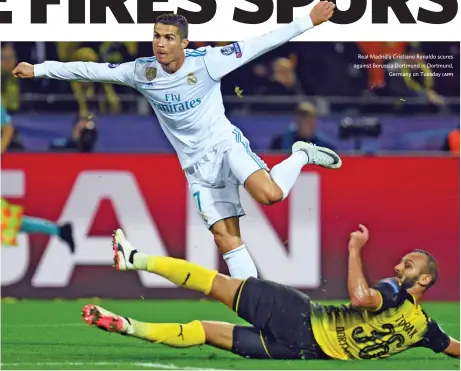  ?? (AFP) ?? Real Madrid's Cristiano Ronaldo scores against Borussia Dortmund in Dortmund, Germany on Tuesday