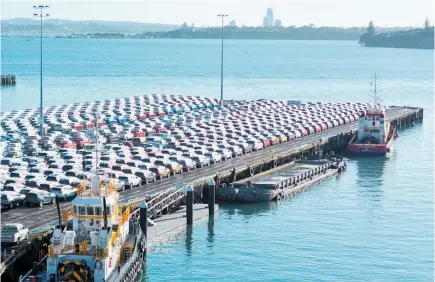  ?? Photo / 123RF ?? New cars imported from Japan line up on Captain Cook Wharf in Ports of Auckland.